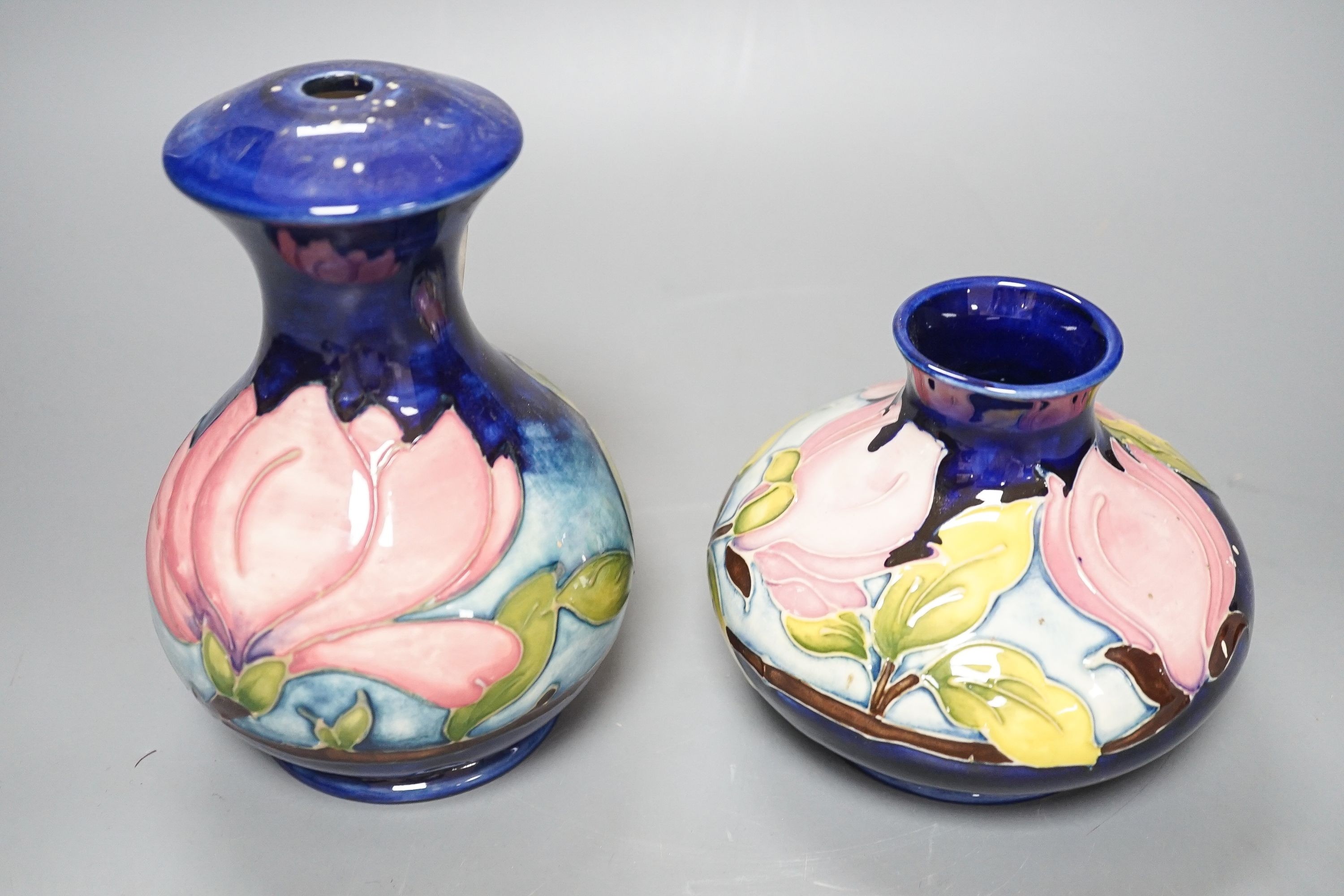 Two Moorcroft magnolia pattern vases 17cm